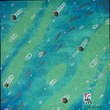 Un banc de poissons tropicaux dans une eau bleue turquoise
